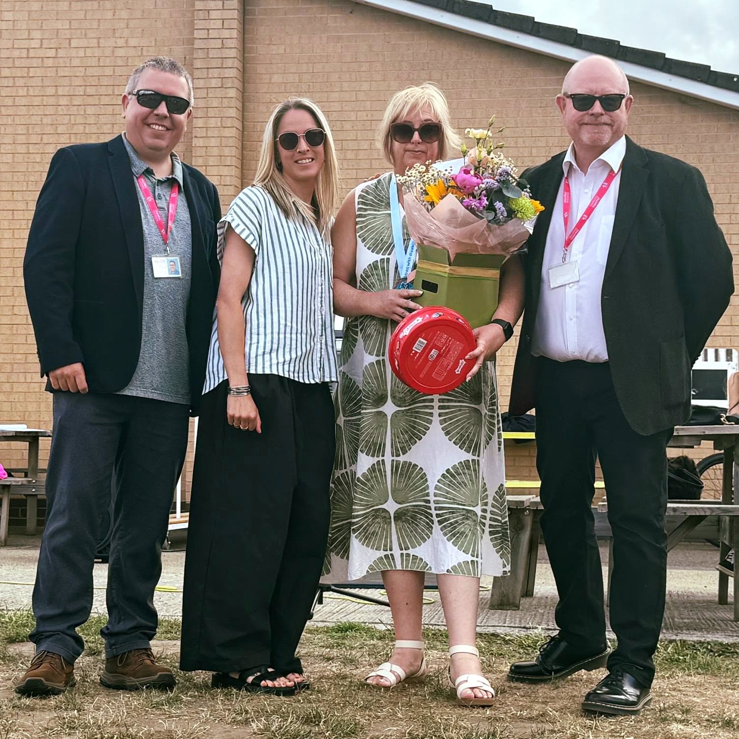 Carly celebrating and presenting at the school
